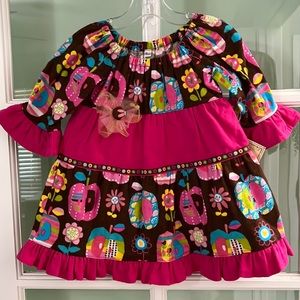 New handmade girls’ flannel dress in a size 18 months.